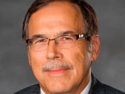 Albert Farrell, Ph.D., in front of a grey screen